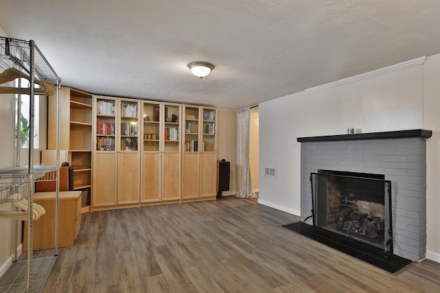 155 Aldrich Rd, Columbus, OH 43214 - unfurnished room featuring wood finished floors and a brick fireplace