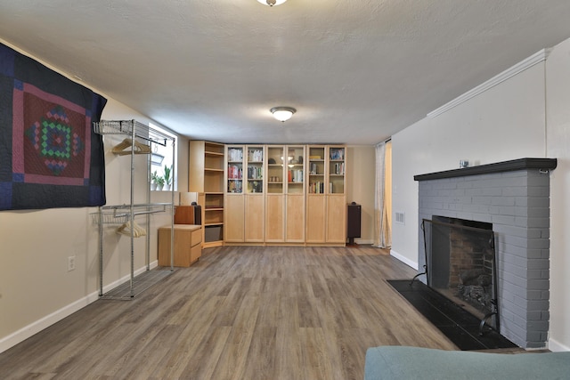155 Aldrich Rd, Columbus, OH 43214 - unfurnished living room featuring a brick fireplace and wood finished floors