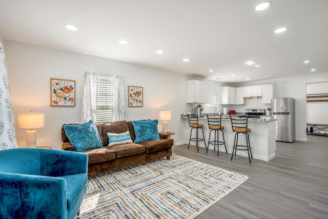 1997 Ferris Rd, Columbus, OH 43224 - living room featuring recessed lighting, light wood-style flooring, and baseboards