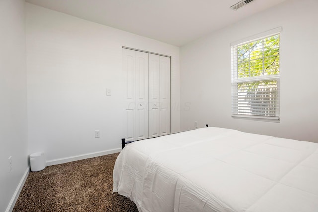 1997 Ferris Rd, Columbus, OH 43224 - bedroom featuring carpet, baseboards, and a closet