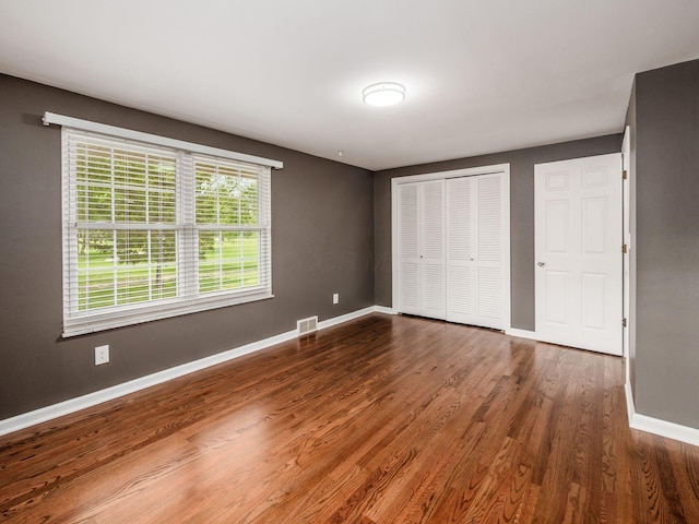 1360 Clubview Blvd S, Columbus, OH 43235 - unfurnished bedroom featuring baseboards, wood finished floors, and a closet