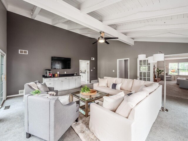 1360 Clubview Blvd S, Columbus, OH 43235 - living area featuring light colored carpet, beam ceiling, a ceiling fan, baseboards, and high vaulted ceiling