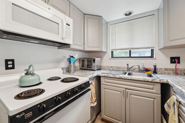 2422 Briers Dr Unit D, Columbus, OH 43209 - kitchen featuring white appliances, a sink, and light countertops