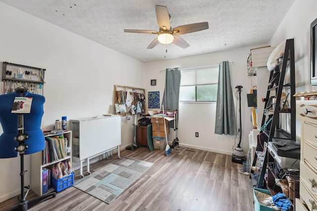 2422 Briers Dr Unit D, Columbus, OH 43209 - office space featuring wood finished floors, a ceiling fan, a textured ceiling, and baseboards