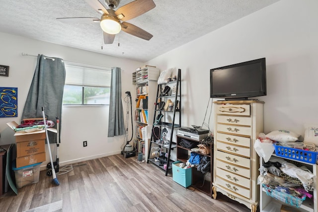 2422 Briers Dr Unit D, Columbus, OH 43209 - bedroom with a textured ceiling, wood finished floors, and ceiling fan