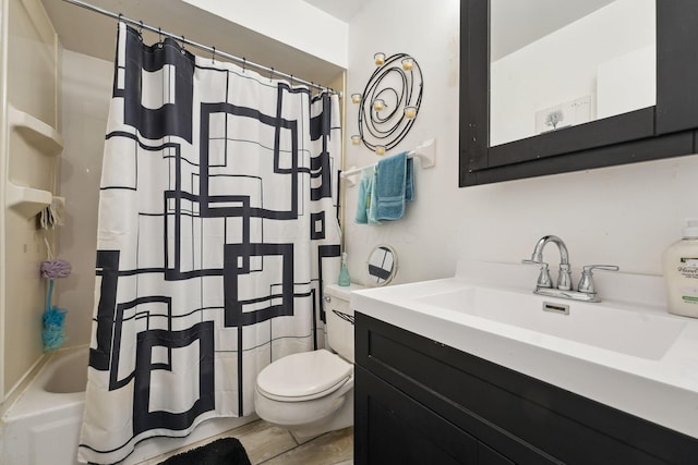 2422 Briers Dr Unit D, Columbus, OH 43209 - full bathroom featuring vanity, toilet, and shower / bath combo with shower curtain