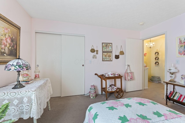 4714 Athalia Dr Unit 26B, Columbus, OH 43228 - carpeted bedroom featuring a closet and a chandelier