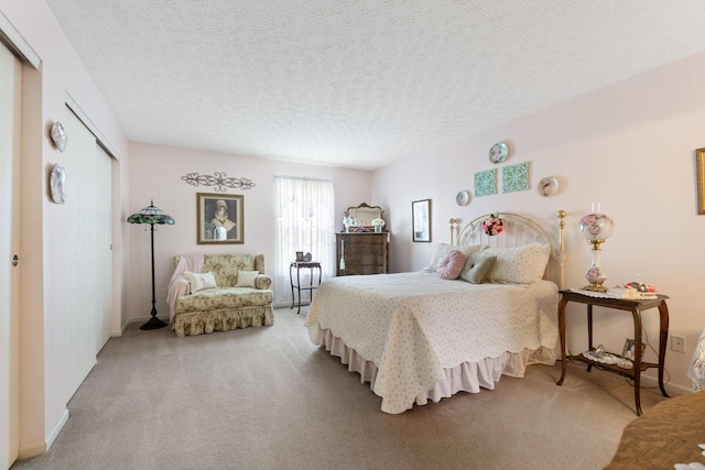 4714 Athalia Dr Unit 26B, Columbus, OH 43228 - bedroom with light carpet, a closet, and a textured ceiling