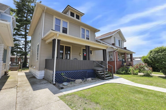 421 E Main St, Newark, OH 43055 - american foursquare style home featuring a porch and a front yard