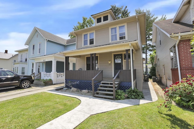 421 E Main St, Newark, OH 43055 - traditional style home featuring a porch, a front yard, and cooling unit