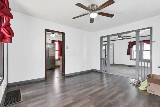 421 E Main St, Newark, OH 43055 - empty room with wood finished floors, ceiling fan, and baseboards