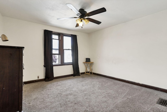 421 E Main St, Newark, OH 43055 - carpeted empty room with baseboards and ceiling fan