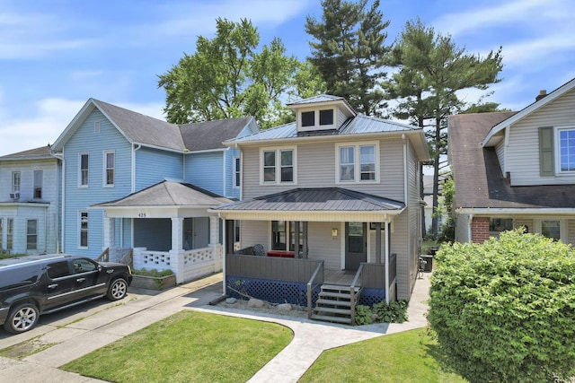 421 E Main St, Newark, OH 43055 - traditional style home featuring covered porch, metal roof, and a front lawn
