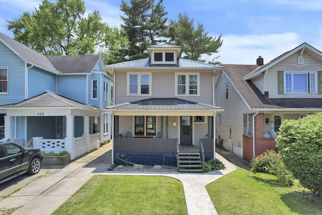 421 E Main St, Newark, OH 43055 - american foursquare style home with covered porch, metal roof, a front lawn, and a standing seam roof
