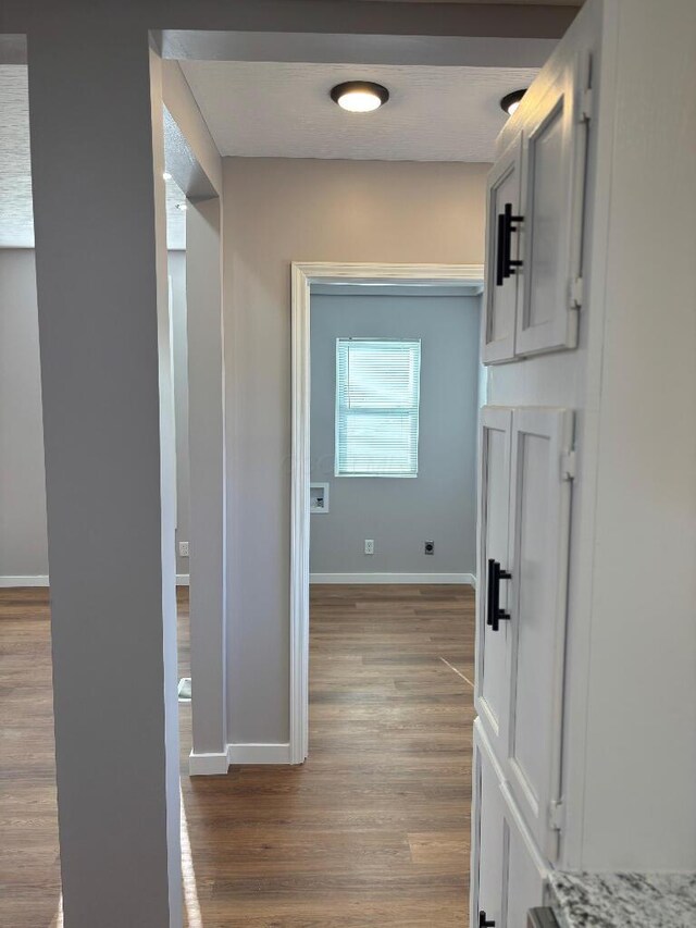 418 Clinton St, Circleville, OH 43113 - hall with dark wood-type flooring and baseboards