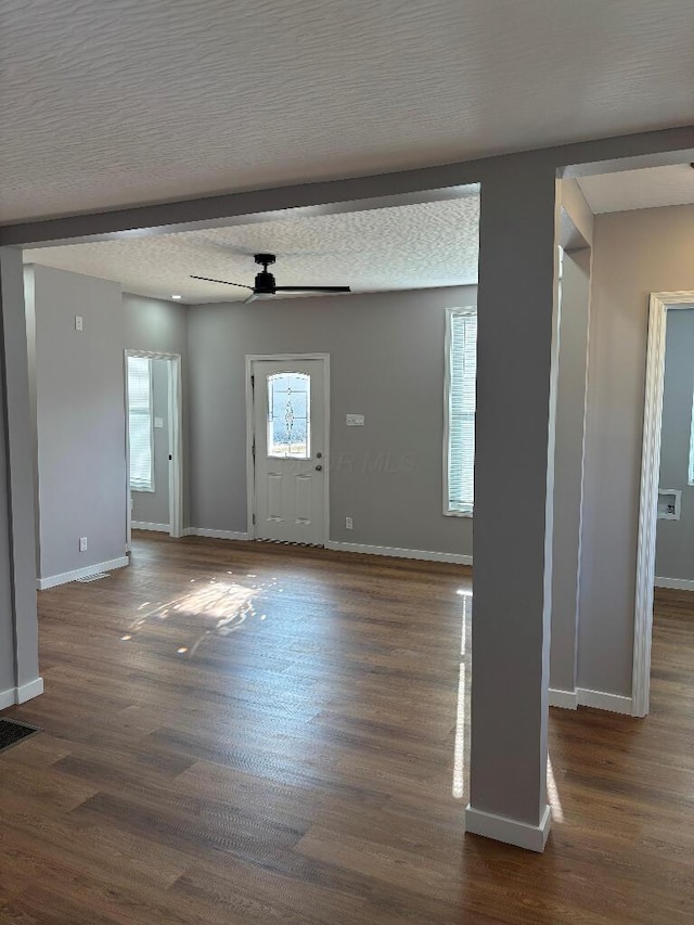 418 Clinton St, Circleville, OH 43113 - entrance foyer with baseboards, dark wood-type flooring, ceiling fan, and a textured ceiling