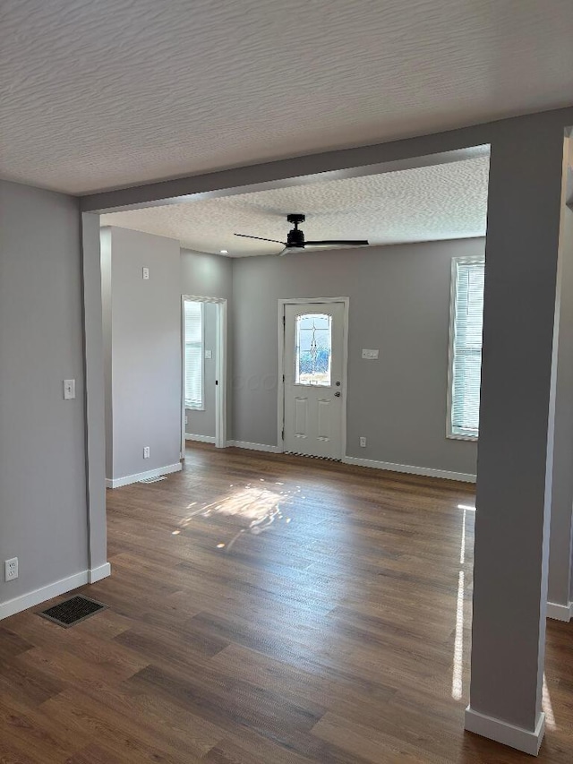 418 Clinton St, Circleville, OH 43113 - entryway featuring a ceiling fan, baseboards, dark wood-style flooring, and a textured ceiling