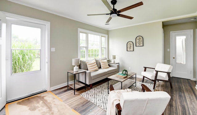 2474 Mecca Rd, Columbus, OH 43224 - living room with wood finished floors, a ceiling fan, baseboards, and crown molding