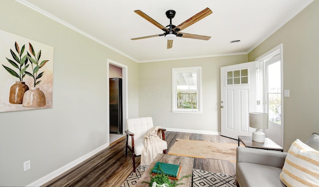 2474 Mecca Rd, Columbus, OH 43224 - living area featuring dark wood-style flooring, healthy amount of natural light, crown molding, and baseboards