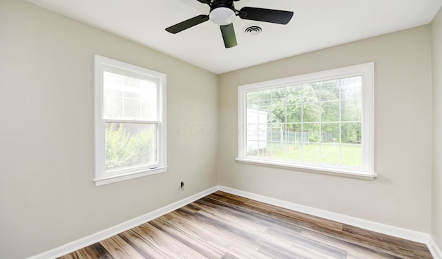 2474 Mecca Rd, Columbus, OH 43224 - spare room with baseboards and wood finished floors