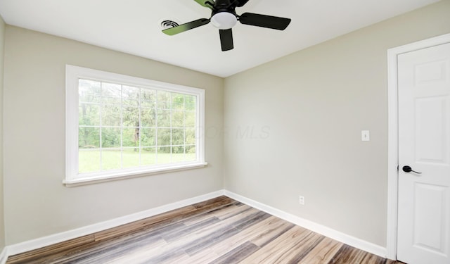 2474 Mecca Rd, Columbus, OH 43224 - spare room featuring wood finished floors, baseboards, and ceiling fan