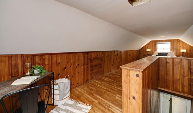 2474 Mecca Rd, Columbus, OH 43224 - bonus room featuring wood walls, lofted ceiling, and light wood-type flooring
