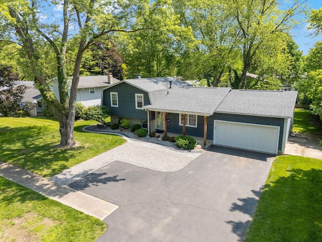 5770 Linworth Rd, Columbus, OH 43235 - tri-level home featuring driveway, roof with shingles, a front yard, and a garage