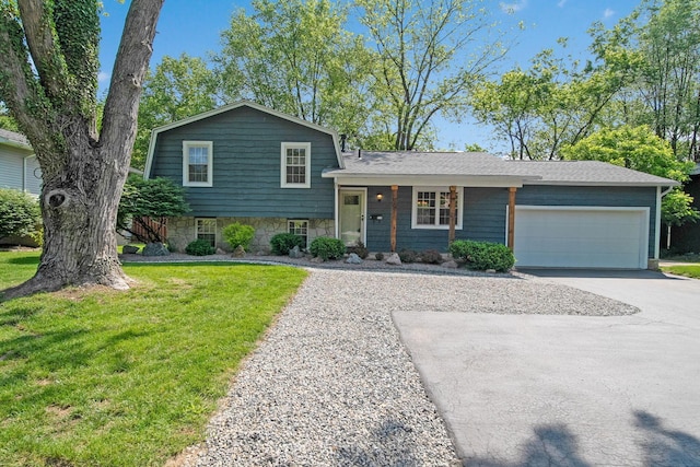 5770 Linworth Rd, Columbus, OH 43235 - split level home featuring driveway, a front yard, an attached garage, and stone siding