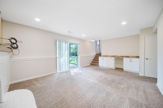 5770 Linworth Rd, Columbus, OH 43235 - unfurnished living room featuring light colored carpet, stairway, baseboards, and recessed lighting