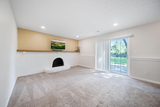 5770 Linworth Rd, Columbus, OH 43235 - unfurnished living room with carpet, a brick fireplace, recessed lighting, and baseboards