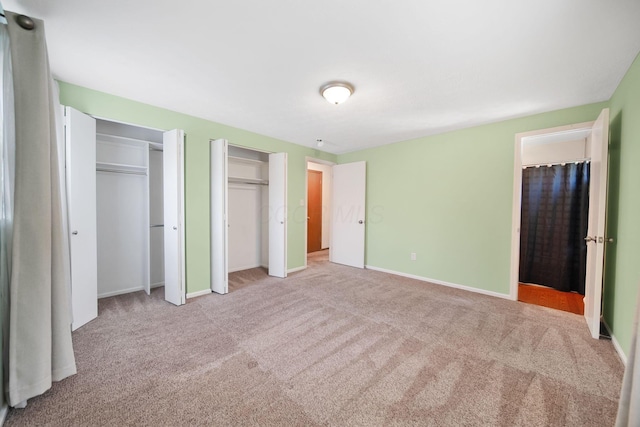 5770 Linworth Rd, Columbus, OH 43235 - unfurnished bedroom featuring multiple closets, carpet floors, and baseboards