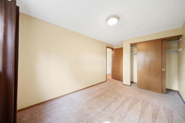5770 Linworth Rd, Columbus, OH 43235 - unfurnished bedroom with light carpet, a closet, and baseboards