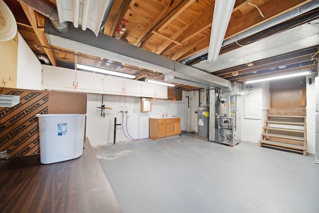 5770 Linworth Rd, Columbus, OH 43235 - unfinished basement with electric water heater, heating unit, and stairs