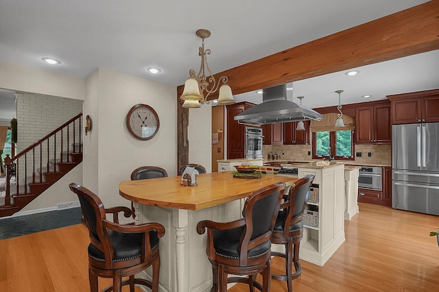 1059 Circle On The Grn, Columbus, OH 43235 - dining area with stairs, light wood-style flooring, and recessed lighting