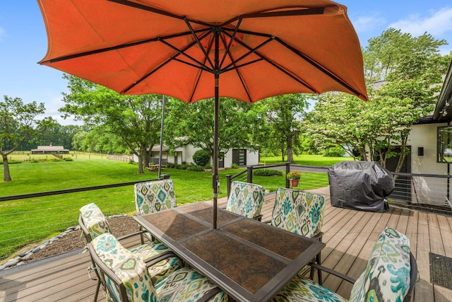 3515 Babbitt Rd, Blacklick, OH 43004 - wooden deck with outdoor dining area, a yard, a grill, and a shed