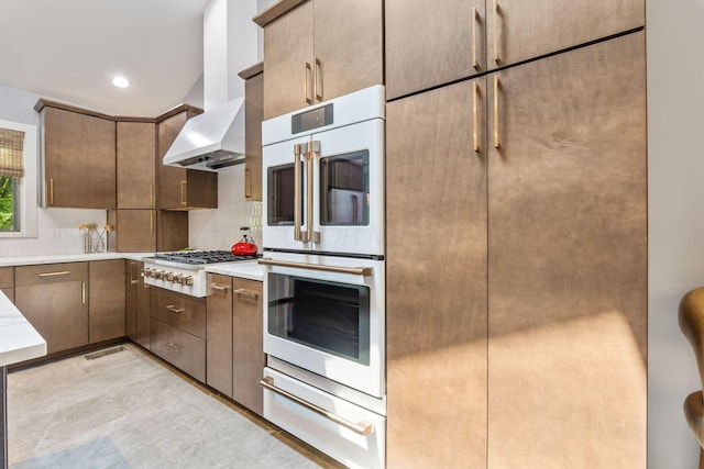 3515 Babbitt Rd, Blacklick, OH 43004 - kitchen featuring a warming drawer, stainless steel gas cooktop, double oven, decorative backsplash, and light countertops