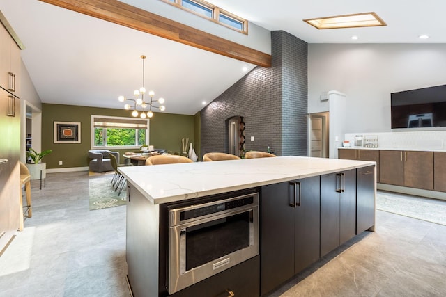 3515 Babbitt Rd, Blacklick, OH 43004 - kitchen featuring open floor plan, beamed ceiling, light stone countertops, decorative light fixtures, and a chandelier