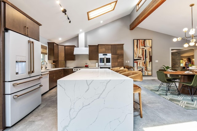 3515 Babbitt Rd, Blacklick, OH 43004 - kitchen featuring white appliances, dark brown cabinets, a center island, hanging light fixtures, and tasteful backsplash