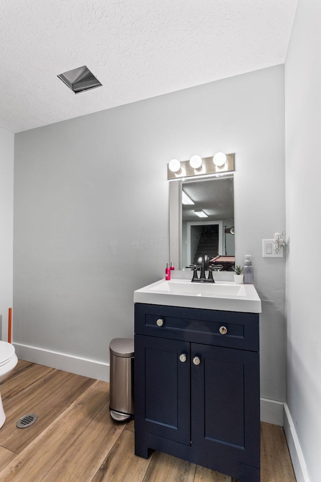 3515 Babbitt Rd, Blacklick, OH 43004 - bathroom with vanity, wood finished floors, and a textured ceiling