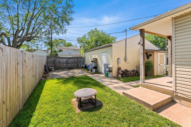 3009 Hiawatha St, Columbus, OH 43224 - view of yard featuring an outbuilding and a patio area