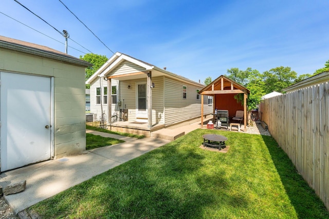 3009 Hiawatha St, Columbus, OH 43224 - back of property featuring an outdoor fire pit