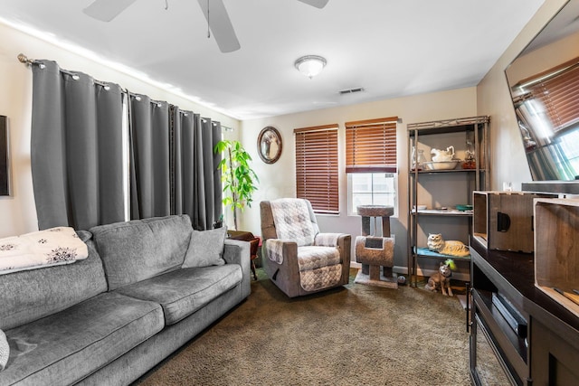 3009 Hiawatha St, Columbus, OH 43224 - living room with a ceiling fan and dark colored carpet