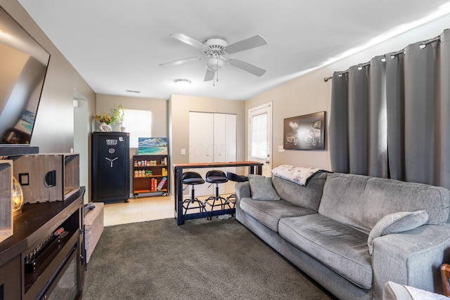3009 Hiawatha St, Columbus, OH 43224 - carpeted living room featuring plenty of natural light and ceiling fan