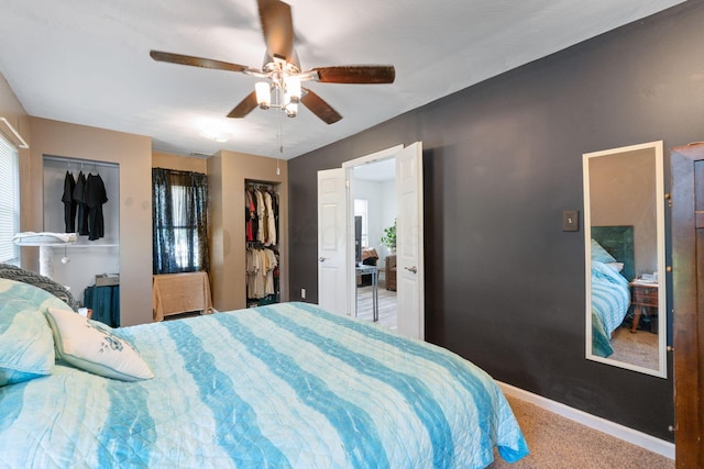 3009 Hiawatha St, Columbus, OH 43224 - bedroom featuring carpet, multiple closets, baseboards, and a ceiling fan
