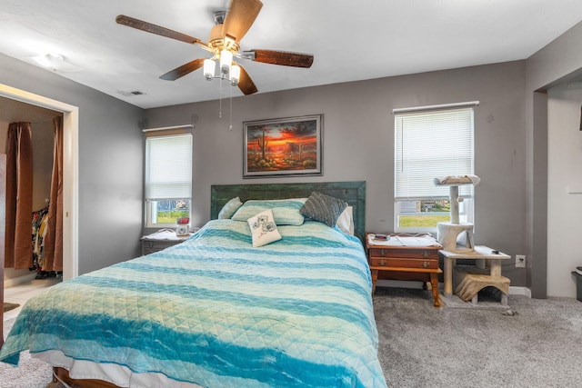3009 Hiawatha St, Columbus, OH 43224 - carpeted bedroom with multiple windows and a ceiling fan
