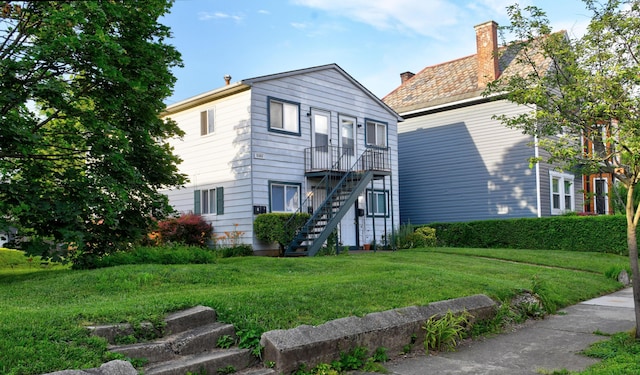 1088 Franklin Ave, Columbus, OH 43205 - view of front facade featuring a front lawn, stairway, and a chimney