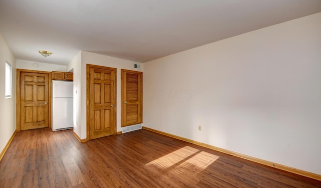 1088 Franklin Ave, Columbus, OH 43205 - spare room featuring baseboards and wood finished floors