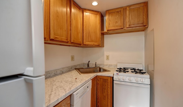 1088 Franklin Ave, Columbus, OH 43205 - kitchen with white appliances, light countertops, brown cabinets, and recessed lighting