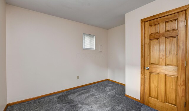 1088 Franklin Ave, Columbus, OH 43205 - unfurnished room featuring baseboards and dark carpet