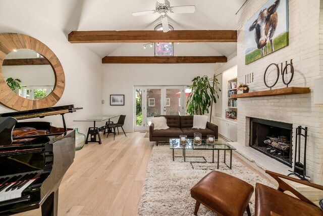 584 Franklin Ave, Columbus, OH 43215 - living area with beamed ceiling, wood finished floors, ceiling fan, a fireplace, and high vaulted ceiling